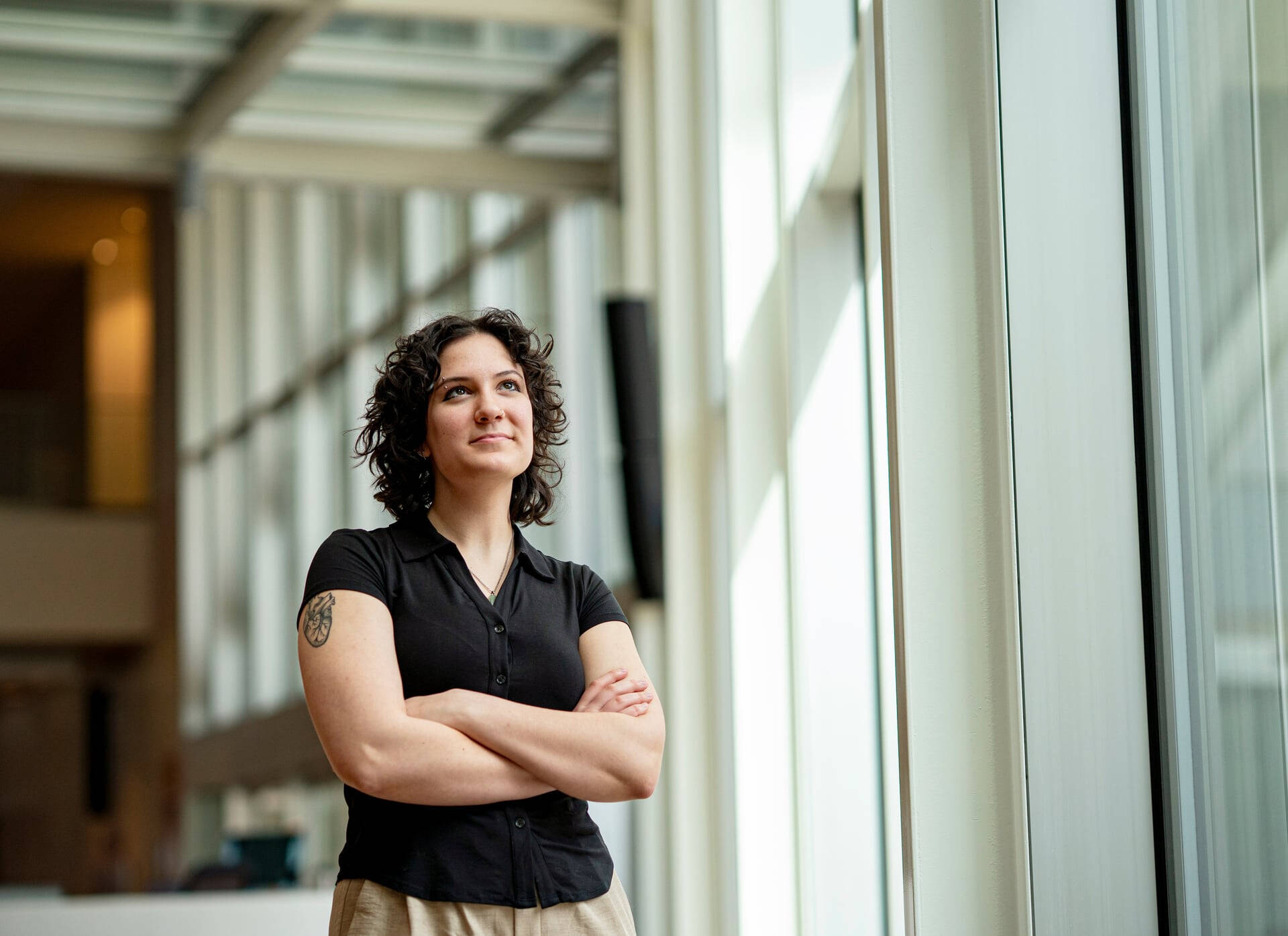 Lola standing in Van Andel during internship.